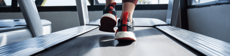 View of athletic shoes on treadmil